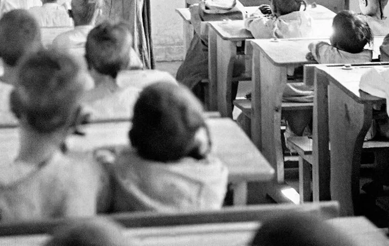 Moroccan Berber children get an arithmetic lesson in December 1945 in the French special "educational school" of Goulmina in the Tafilalet region in South-east Morocco which then was a French protectorate. 
De jeunes Marocains suivent une leÁon d'arithmÈtique dans une classe d'un "cours Èducatif" franÁais pour les enfants berbËres ‡ l'Ècole de Goulmina dans la rÈgion de Tafilalet au sud-est du Maroc alors sous protectorat franÁais en dÈcembre 1945. (Photo by AFP)