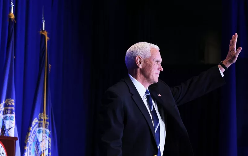 NASHUA, NEW HAMPSHIRE - OCTOBER 14: Republican presidential candidate former U.S. Vice President Mike Pence waves as he takes the stage during the 2023 First in the Nation Leadership Summit on October 14, 2023 in Nashua, New Hampshire. The two day event, hosted by the New Hampshire Republican Party, will feature Republican Presidential candidates, elected officials, and Republican leaders from across the nation to discuss conservative solutions to todays issues. Former President Donald Trump, who is leading the other GOP contenders by a wide margin in polls in New Hampshire, has elected not to attend the event.   Michael M. Santiago/Getty Images/AFP (Photo by Michael M. Santiago / GETTY IMAGES NORTH AMERICA / Getty Images via AFP)
