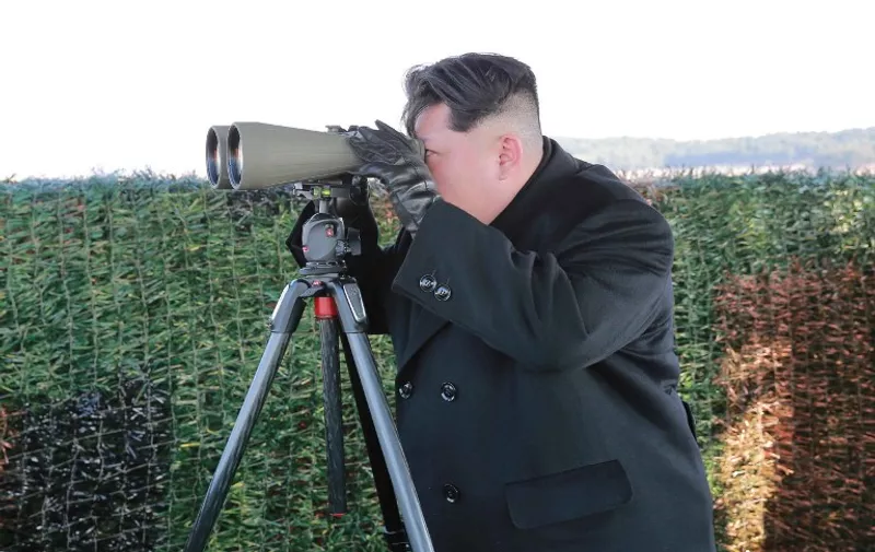 This undated picture released from North Korea's official Korean Central News Agency (KCNA) on February 27, 2016 shows North Korean leader Kim Jong-Un inspecting the test-fire of a newly developed anti-tank guided weapon at an undisclosed location.  North Korea on February 27 boasted of a newly developed anti-tank weapon that its leader said was so powerful it could turn the most heavily armoured enemy tanks into "boiled pumpkin".      REPUBLIC OF KOREA OUT     AFP PHOTO / KCNA via KNS 
 ---EDITORS NOTE--- RESTRICTED TO EDITORIAL USE - MANDATORY CREDIT "AFP PHOTO/KCNA VIA KNS" - NO MARKETING NO ADVERTISING CAMPAIGNS - DISTRIBUTED AS A SERVICE TO CLIENTS  
 THIS PICTURE WAS MADE AVAILABLE BY A THIRD PARTY. AFP CAN NOT INDEPENDENTLY VERIFY THE AUTHENTICITY, LOCATION, DATE AND CONTENT OF THIS IMAGE. THIS PHOTO IS DISTRIBUTED EXACTLY AS RECEIVED BY AFP.      / AFP / KCNA / KNS