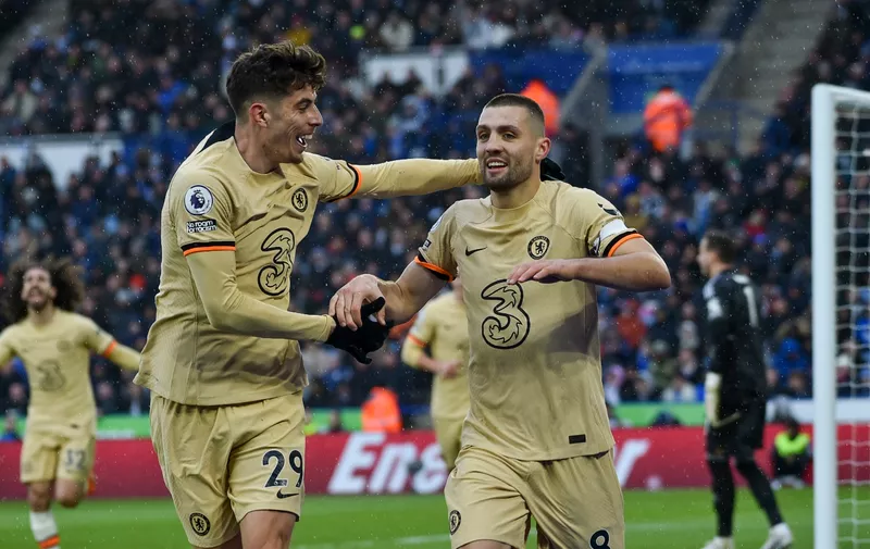 Chelsea's Mateo Kovacic, right, celebrates scoring his side's 3rd goal during the English Premier League soccer match between Leicester City and Chelsea at King Power stadium in Leicester, England, Saturday, March 11, 2023. (AP Photo/Rui Vieira)