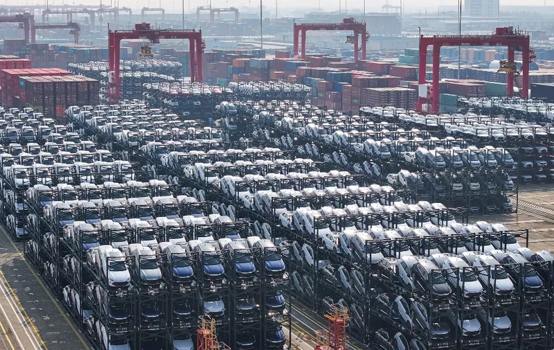 BYD electric cars waiting to be loaded onto a ship are seen stacked at the international container terminal of Taicang Port in Suzhou, in Chinas eastern Jiangsu province on February 8, 2024. (Photo by AFP) / China Out
