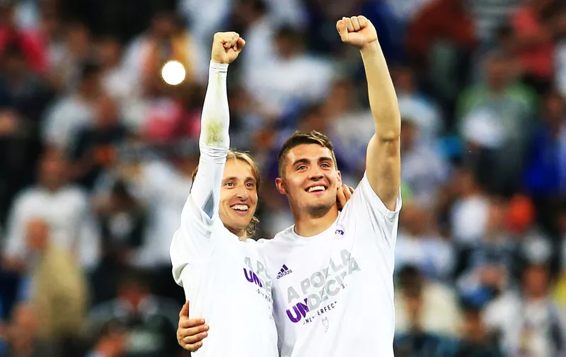 Real Madrid&#8217;s Luka Modric (left) and Mateo Kovacic celebrate after the final whistle following the UEFA Champions League Semi Final, Second Leg match at the Santiago Bernabeu, Madrid., Image: 283418820, License: Rights-managed, Restrictions: WCDIRECT, Model Release: no, Credit line: Profimedia, Press Association