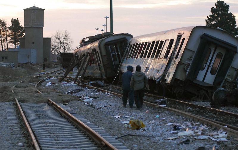 Iranians inspect the site of a derailed train which was travelling from Iran's second city of Mashhad in the northeast to Tehran on January 23, 2010. At least seven people were killed and another 12 were injured when the train derailed, an official told state-run television. AFP PHOTO/MEHDI GHORBANI (Photo by MEHDI GHORBANI / AFP)