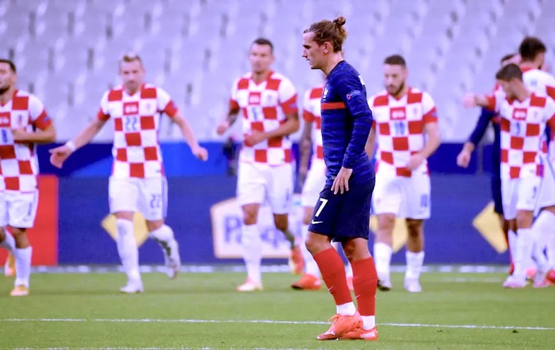 France's forward Antoine Griezmann reacts as Croatia's players celebrate a goal during the UEFA Nations League Group C football match between France and Croatia on September 8, 2020  at the Stade de France in Saint-Denis, near Paris. (Photo by FRANCK FIFE / AFP)