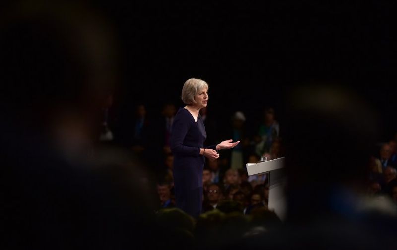 Britain's Home Secretary Theresa May gives a speech on the third day of the annual Conservative party conference in Manchester, north west England, on October 6, 2015. AFP PHOTO / LEON NEAL / AFP PHOTO / LEON NEAL