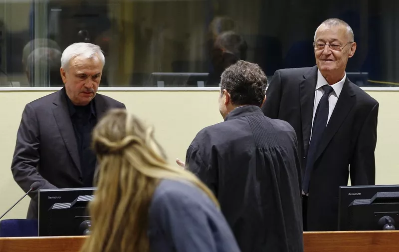 EDITORS NOTE: Graphic content / Former Serbian intelligence chiefs, Jovica Stanisic (L) and Franko Simatovic (R) appear in court as they go back on trial before a UN court in The Hague on June 13, 2017 at the United Nations Mechanism for International Criminal Tribunal, accused of running death squads that terrorised Bosnia and Croatia in the bloody 1990s Balkans wars. (Photo by Michael Kooren / ANP / AFP) / Netherlands OUT