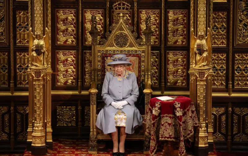(FILES) In this file photo taken on May 11, 2021 Britain's Queen Elizabeth II sits on the The Sovereign's Throne in the House of Lords chamber during the State Opening of Parliament at the Houses of Parliament in London, which is taking place with a reduced capacity due to Covid-19 restrictions. - The doctors of Queen Elizabeth II, 96, are "concerned" about her health and "have recommended that she be placed under medical supervision" at her castle in Balmoral, Scotland, Buckingham Palace said on September 8, 2022. "Following a further assessment this morning, the Queen's doctors are concerned for Her Majesty's health and have recommended that she remains under medical supervision. The Queen continues to be comfortable and at Balmoral," the palace said in a brief statement. (Photo by Chris Jackson / POOL / AFP)