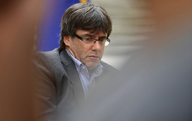 Catalan president Carles Puigdemont looks on during an AFP interview in Girona on September 30, 2017.
The mission was entrusted to him almost by accident, but he accomplished it with determination. Deaf to the warnings of Madrid, the Catalan regional president Carles Puigdemont is determined to organize a referendum on October 1, 2017, hoping to fulfill his dream of youth: an independent Catalonia. / AFP PHOTO / PIERRE-PHILIPPE MARCOU / TO GO WITH AFP INTERVIEW by DANIEL BOSQUE