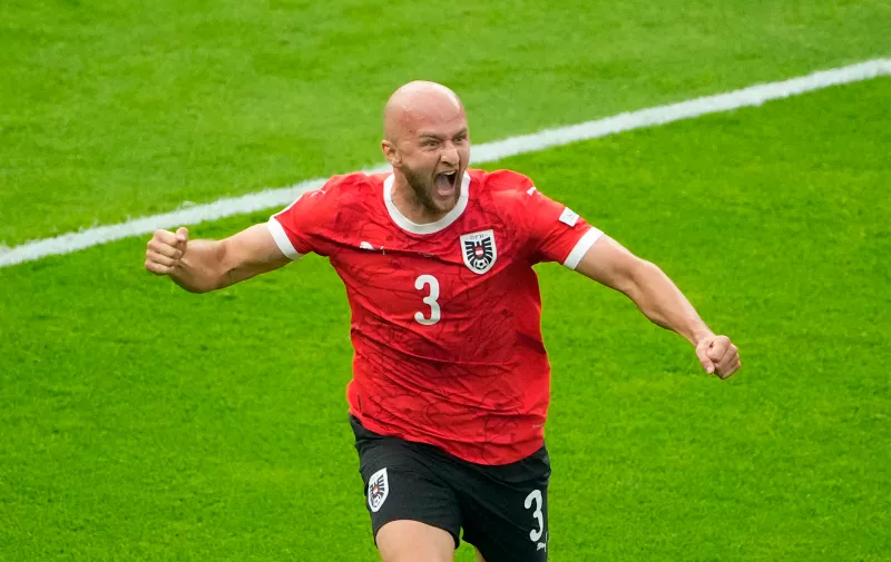 Austria's Gernot Trauner celebrates after scoring the opening goal during a Group D match between Poland and Austria at the Euro 2024 soccer tournament in Berlin, Germany, Friday, June 21, 2024. (AP Photo/Petr Josek)