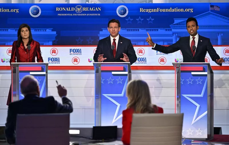 (L-R) Former Governor from South Carolina and UN ambassador Nikki Haley, Florida Governor Ron DeSantis, and entrepreneur Vivek Ramaswamy speak during the second Republican presidential primary debate at the Ronald Reagan Presidential Library in Simi Valley, California, on September 27, 2023. (Photo by Robyn BECK / AFP)