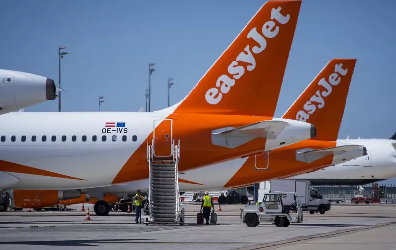 A picture taken on August 6, 2018 shows Easy Jet planes on the tarmac Roissy Charles de Gaulle Airport, north of Paris. (Photo by JOEL SAGET / AFP)