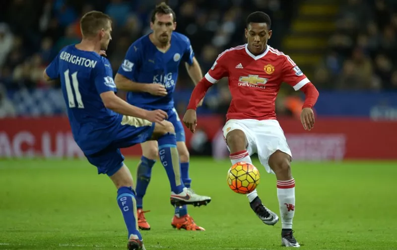 Manchester United's French striker Anthony Martial (R) controls the ball by Leicester City's English midfielder Marc Albrighton during the English Premier League football match between Leicester City and Manchester United at the King Power Stadium in Leicester, central England on November 28, 2015.  AFP PHOTO / OLI SCARFF

RESTRICTED TO EDITORIAL USE. No use with unauthorized audio, video, data, fixture lists, club/league logos or 'live' services. Online in-match use limited to 75 images, no video emulation. No use in betting, games or single club/league/player publications. / AFP / OLI SCARFF