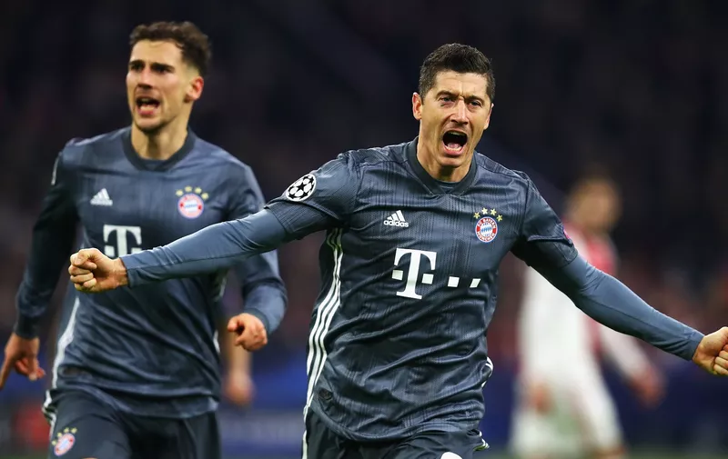 AMSTERDAM, NETHERLANDS - DECEMBER 12:  Robert Lewandowski of Bayern Muenchen celebrates scoring his teams second goal of the game during the UEFA Champions League Group E match between Ajax and FC Bayern Munich at Johan Cruyff Arena on December 12, 2018 in Amsterdam, Netherlands.  (Photo by Dean Mouhtaropoulos/Getty Images)