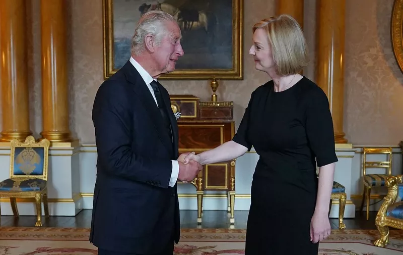 Britain's King Charles III (L) greets Britain's Prime Minister Liz Truss (R) during their first meeting at Buckingham Palace in London on September 9, 2022. - Queen Elizabeth II, the longest-serving monarch in British history and an icon instantly recognisable to billions of people around the world, died at her Scottish Highland retreat on September 8. (Photo by Yui Mok / POOL / AFP)