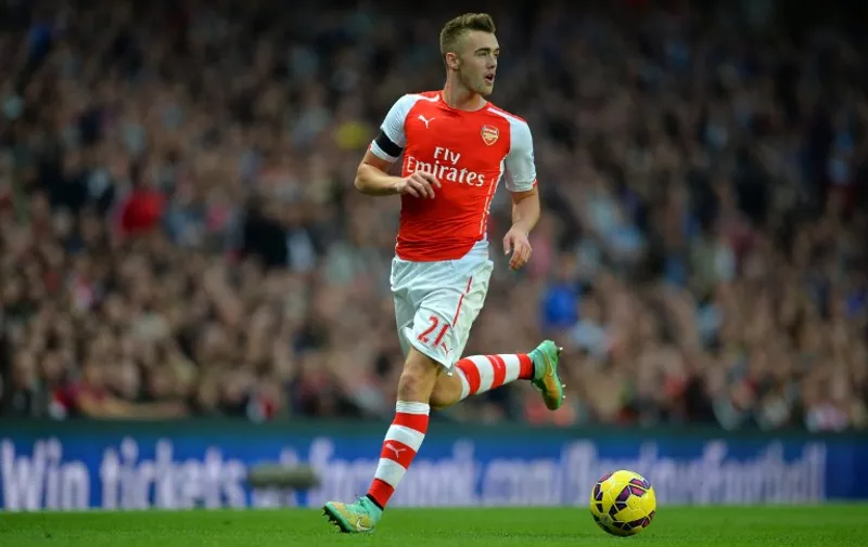 Arsenal's English defender Calum Chambers controls the ball during the English Premier League football match between Arsenal and Burnley at Emirates Stadium in London on November 1, 2014.  AFP PHOTO / GLYN KIRK 

RESTRICTED TO EDITORIAL USE. No use with unauthorized audio, video, data, fixture lists, club/league logos or live services. Online in-match use limited to 45 images, no video emulation. No use in betting, games or single club/league/player publications.