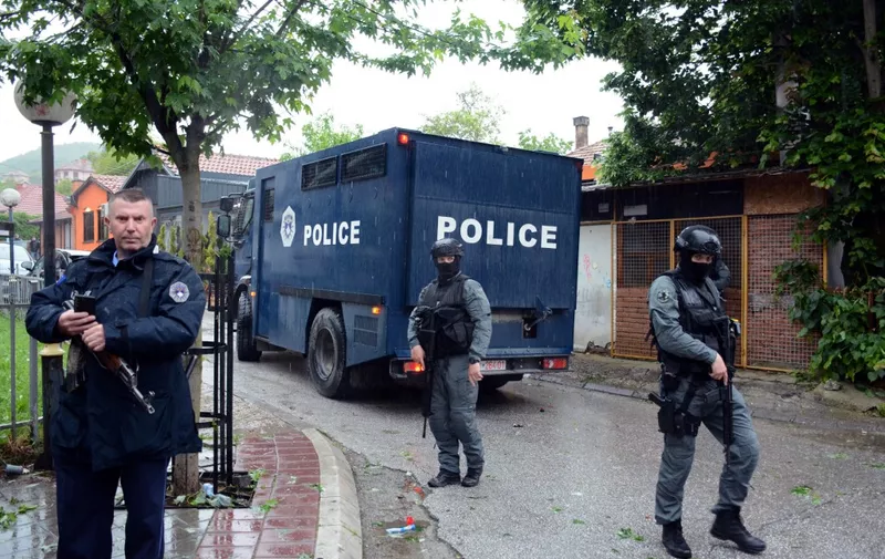 Kosovo riot police secure a municipal building after using tea gas to disperse Serbs demonstrating after police helped install ethnic Albanian mayors following controversial elections in the Serb-majority town of Zvecan on May 26, 2023. (Photo by STRINGER / AFP)