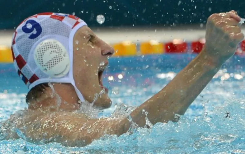 Croatia's Sandro Sukno reacts during the men's water polo gold medal match Croatia vs Italy at the London 2012 Olympic Games in London on August 12, 2012.         AFP PHOTO / ADEK BERRY