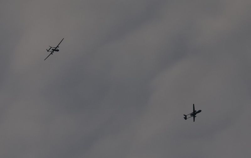 A picture taken from Israel's southern city of Sderot shows Israeli Heron military drones over the northern Gaza Strip, on October 29, 2023, amid ongoing battles between Israel and the Palestinian Hamas movement. (Photo by JACK GUEZ / AFP)