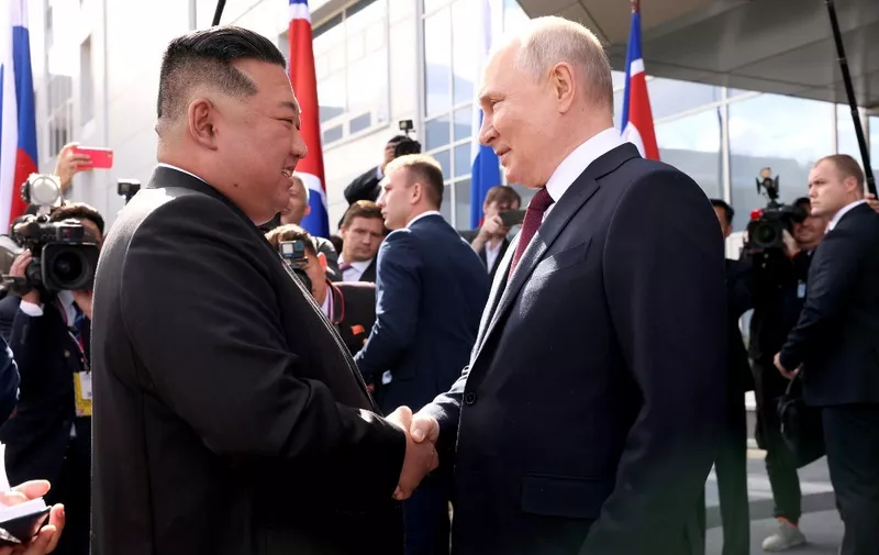 AMUR REGION, RUSSIA - SEPTEMBER 13: (----EDITORIAL USE ONLY - MANDATORY CREDIT - 'KREMLIN PRESS OFFICE / HANDOUT' - NO MARKETING NO ADVERTISING CAMPAIGNS - DISTRIBUTED AS A SERVICE TO CLIENTS----) Russian President Vladimir Putin (R) shakes hand with North Korean leader Kim Jong-Un (L) ahead of the their inspect the Russian spaceport Vostochny Cosmodrome in Russia's Amur region in the Far East on September 13, 2023. North Korean leader Kim Jong-Un said on Wednesday that relations with Russia are 'the very first priority' for his country. Putin and Kim then visited several facilities of the cosmodrome and also examined the construction of the new infrastructure. Kremlin Press Office / Handout / Anadolu Agency (Photo by Kremlin Press Office / Handout / ANADOLU AGENCY / Anadolu Agency via AFP)