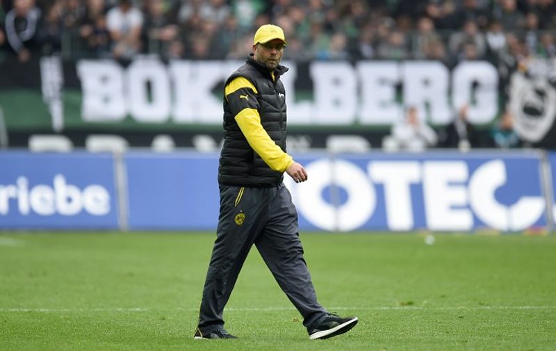 (FILES) A photo taken on April 11, 2015 shows Dortmund&#8217;s head coach Juergen Klopp walking on the pitch after the German first division Bundesliga football match between Borussia Moenchengladbach v Borussia Dortmund BVB in Moenchengladbach, Germany. According to an article released on April 15, 2015 on the website of German tabloid Bild, Klopp is to [&hellip;]