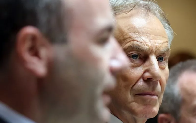 Britian's former Prime Minsiter Tony Blair (R) attends the European People's Party (EPP) group bureau meeting at the Druids Glen Hotel in Wicklow, eastern Ireland on May 12, 2017. - The European Union's chief Brexit negotiator, Michel Barnier, yesterday sought to ease tensions between the bloc and Britain, saying a deal was possible if the talks were conducted without "aggressivity". (Photo by Paul FAITH / AFP)