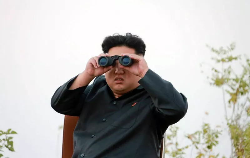 This undated picture released from North Korea's official Korean Central News Agency (KCNA) on October 19, 2014 shows North Korean leader Kim Jong-Un using a pair of binoculars as he inspects the takeoff and landing drill on a highway-airfield conducted by fighter pilots of Korean People's Army Air and Anti-Air Force Units 1017 and 458 at an undisclosed location in North Korea.  AFP PHOTO / KCNA via KNS    REPUBLIC OF KOREA OUT
THIS PICTURE WAS MADE AVAILABLE BY A THIRD PARTY. AFP CAN NOT INDEPENDENTLY VERIFY THE AUTHENTICITY, LOCATION, DATE AND CONTENT OF THIS IMAGE. THIS PHOTO IS DISTRIBUTED EXACTLY AS RECEIVED BY AFP.
---EDITORS NOTE--- RESTRICTED TO EDITORIAL USE - MANDATORY CREDIT "AFP PHOTO / KCNA VIA KNS" - NO MARKETING NO ADVERTISING CAMPAIGNS - DISTRIBUTED AS A SERVICE TO CLIENTS
