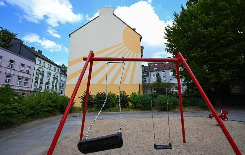 A swing is seen at a playground at the Nordstadt, which is considered a social hotspot, with high unemployment, poverty and crime, in Dortmund, western Germany on July 10, 2023. The basic income support is intended to combine benefits such as child benefit, child allowance, child supplement and those from the so-called education and participation package. Many families do not apply for benefits because of ignorance or bureaucratic hurdles. (Photo by Ina FASSBENDER / AFP)