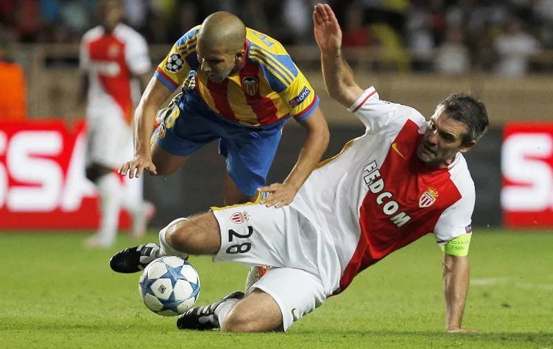 Valencia's French midfielder Sofiane Feghouli  (L) vies with Monaco's French midfielderR) during the UEFA Champions League playoff football match between AS Monaco FC vs Valencia CF, at the Louis II Stadium, in Monaco, on August 25, 2015. 
