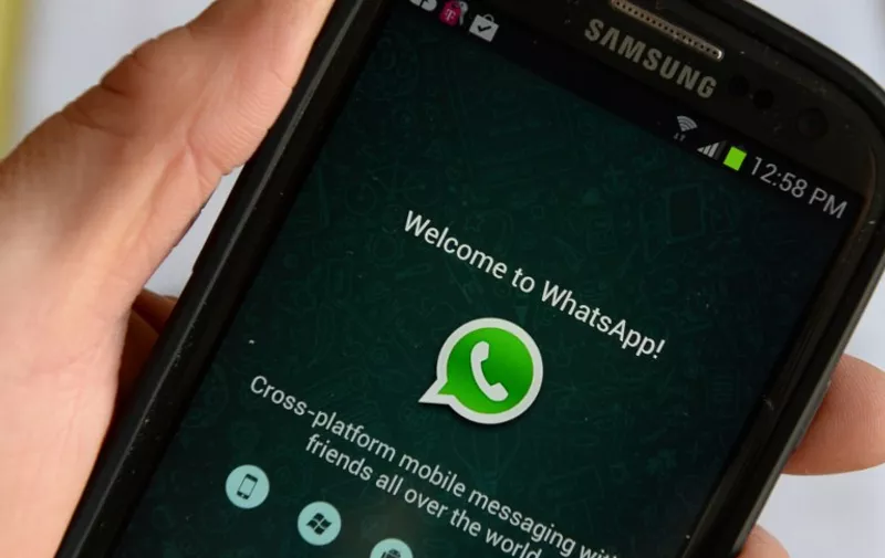 Logo of WhatsApp, the popular messaging service bought by Facebook for USD $19 billion, seen on a smartphone February 20, 2014 in New York.   Facebook's deal for the red-hot mobile messaging service WhatsApp is a savvy strategic move for the world's biggest social network, even if the price tag is staggeringly high, analysts say. AFP PHOTO/Stan HONDA / AFP / STAN HONDA