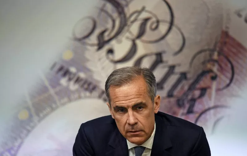 Governor of the Bank of England Mark Carney, speaks during the Bank of England Financial Stability Report press conference, at the central bank in central London on July 5, 2016.
The Bank of England on Tuesday relaxed commercial banks' capital requirements to boost lending to businesses and households, and warned that financial stability risks "have begun to crystallise" after Brexit. BoE governor Mark Carney pledged it would do whatever is needed to aid monetary and fiscal stability in the wake of the June 23 referendum that saw Britain vote to exit the EU. / AFP PHOTO / POOL / DYLAN MARTINEZ