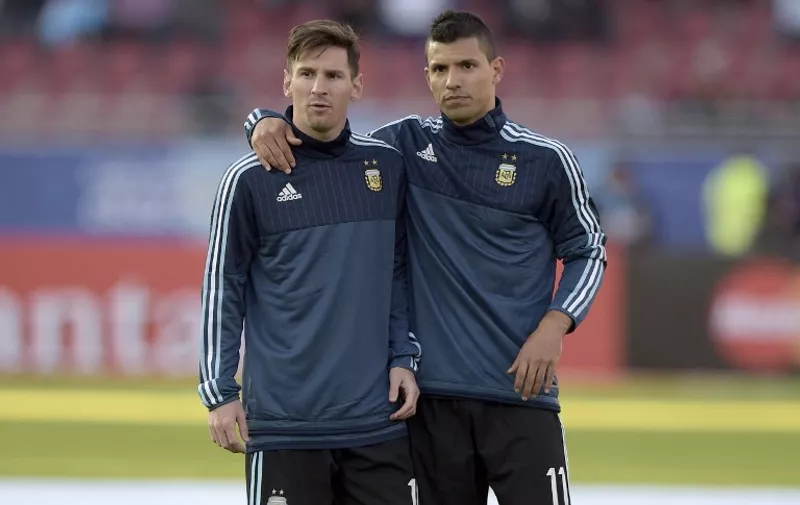 Argentina's forwards Lionel Messi (L) and Sergio Aguero are seen before the start of the 2015 Copa America football championship match against Paraguay, in La Serena, Chile, on June 13, 2015. / 