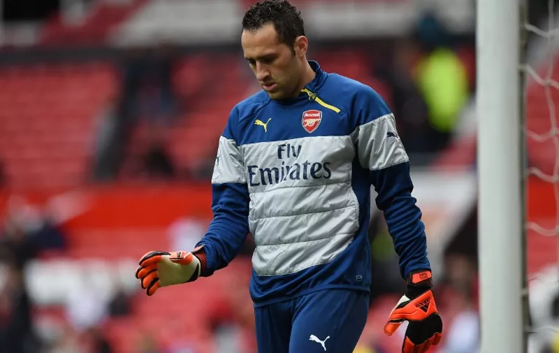 Arsenal's Colombian goalkeeper David Ospina warms up before the English Premier League football match between Manchester United and Arsenal at Old Trafford in Manchester, northwest England, on May 17, 2015. AFP PHOTO / PAUL ELLIS

RESTRICTED TO EDITORIAL USE. No use with unauthorized audio, video, data, fixture lists, club/league logos or live services. Online in-match use limited to 45 images, no video emulation. No use in betting, games or single club/league/player publications