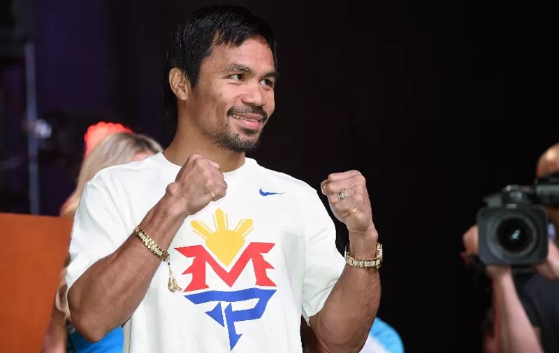 LAS VEGAS, NV - APRIL 28: WBO welterweight champion Manny Pacquiao poses during a fan rally at the Mandalay Bay Convention Center on April 28, 2015 in Las Vegas, Nevada. Pacquiao will face WBC/WBA welterweight champion Floyd Mayweather Jr. in a unification bout on May 2, 2015 in Las Vegas.   /AFP