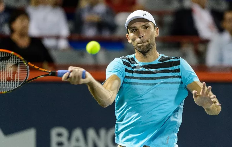 MONTREAL, ON - AUGUST 11: Ivo Karlovic of Croatia hits the ball against Milos Raonic of Canada during day two of the Rogers Cup at Uniprix Stadium on August 11, 2015 in Montreal, Quebec, Canada. Ivo Karlovic defeated Milos Raonic 7-6, 7-6.   Minas Panagiotakis/Getty Images/AFP