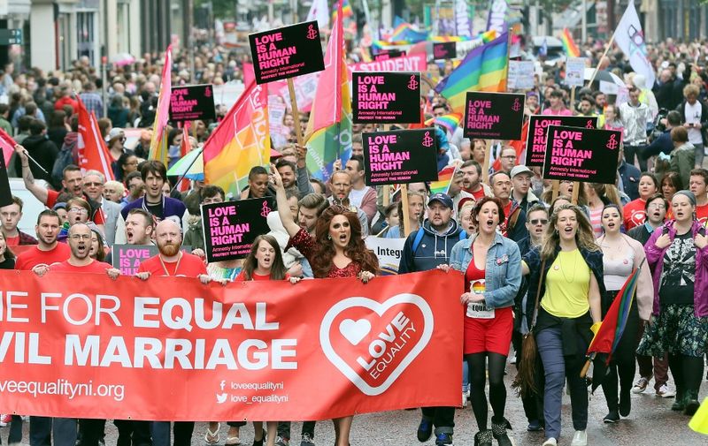 Gay rights campaigners take part in a march through Belfast on July 1, 2017 to protest against the ban on same-sex marriage. (Photo by Paul FAITH / AFP)