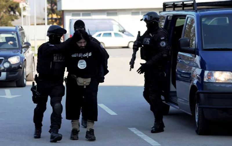 This handout  photo obtained from Bosnia and Herzegovina's State Agency for Investigations and Protection (SIPA) on April 15, 2015 shows SIPA officers conducting an actual arrest in the greater Sarajevo area, on April 15, 2015. Police in Bosnia arrested a man on terrorism charges for allegedly meeting with Islamic State jihadists in Syria. The suspect, named as Kenan Krso, was suspected of "several activities linked with terrorism," a spokesman for the public prosecutor's office told reporters.  RESTRICTED TO EDITORIAL USE - MANDATORY CREDIT  " AFP PHOTO / BOSNIA AND HERZEGOVINA STATE AGENCY FOR INVESTIGATION AND PROTECTION. "  -  NO MARKETING NO ADVERTISING CAMPAIGNS   -   DISTRIBUTED AS A SERVICE TO CLIENTS    / AFP / SIPA / HO