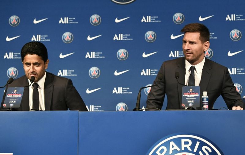 Paris Saint-Germain's Qatari president Nasser Al-Khelaifi (L) and Argentinian football player Lionel Messi attend the player's unveiling press conference at the French football club Paris Saint-Germain's (PSG) Parc des Princes stadium in Paris on August 11, 2021. - The 34-year-old superstar signed a two-year deal with PSG on August 10, 2021, with the option of an additional year, he will wear the number 30 in Paris, the number he had when he began his professional career at Spain's Barca football club. (Photo by STEPHANE DE SAKUTIN / AFP)