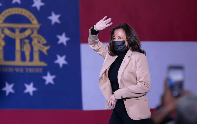 US Vice President-Elect Kamala Harris arrives to speak at a rally in support of Democratic US Senate candidates, Reverend Raphael Warnock and Jon Ossoff, at Garden City Stadium in Savannah, Georgia on January 3, 2021. - The two candidates are competing in a runoff election on January 5th that will decide which party controls the United States Senate. (Photo by Logan Cyrus / AFP)