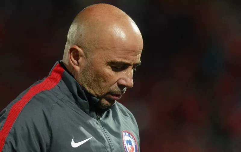 FILE - Chile's head coach Jorge Sampaoli leaves the field at the end of their Russia 2018 FIFA World Cup South American Qualifiers football match against Colombia, in Santiago, on November 12, 2015. Chile coach Jorge Sampoali resigned on January 19, 2015.    AFP PHOTO  / Claudio Reyes / AFP / Claudio Reyes