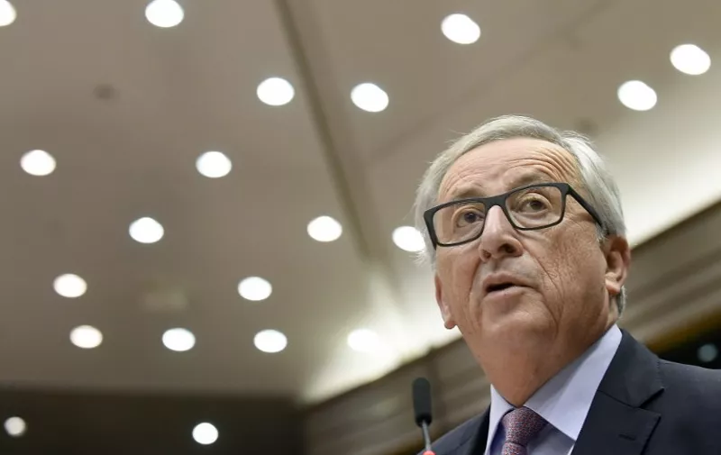 EU Commission President Jean-Claude Juncker speaks during the presentation of the ''White paper on the future of Europe'' at the EU headquarters in Brussels on March 1, 2017. 
Juncker revealed his plans to save the EU, warning the troubled bloc must now write a "new chapter" after Britain's expected exit in 2019. The former Luxembourg premier laid out five "pathways to unity" for European Union leaders to consider at a special summit in Rome on March 25 to mark the 60th anniversary of the bloc's founding treaty. / AFP PHOTO / JOHN THYS