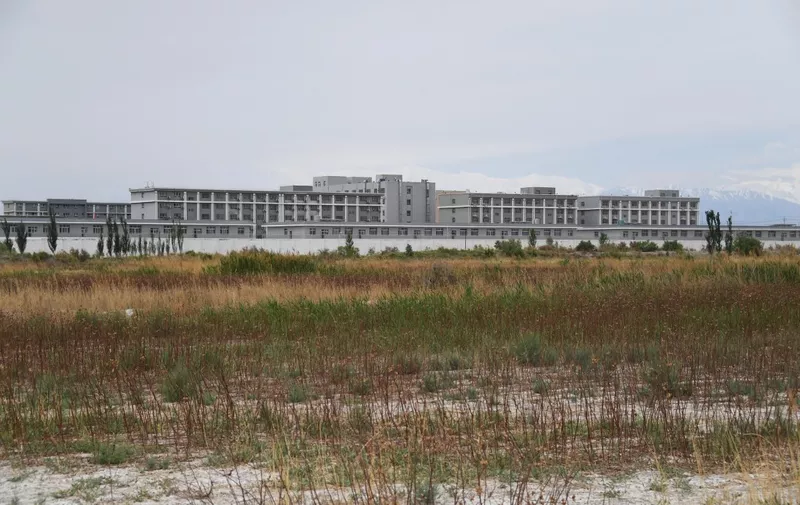 This photo taken on June 4, 2019 shows a facility believed to be a re-education camp where mostly Muslim ethnic minorities are detained, north of Akto in China's northwestern Xinjiang region. - As many as one million ethnic Uighurs and other mostly Muslim minorities are believed to be held in a network of internment camps in Xinjiang, but China has not given any figures and describes the facilities as "vocational education centres" aimed at steering people away from extremism. (Photo by GREG BAKER / AFP) / TO GO WITH AFP STORY CHINA-XINJIANG-MEDIA-RIGHTS-PRESS,FOCUS BY EVA XIAO