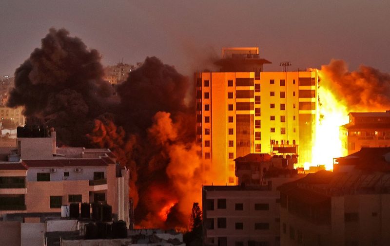 Smoke billows from an Israeli air strike on the Hanadi compound in Gaza City, controlled by the Palestinian Hamas movement, on May 11, 2021. (Photo by MOHAMMED ABED / AFP)