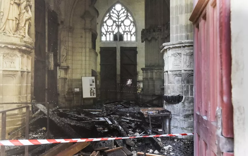 This photograph taken on July 18, 2020, shows the damage inside the Saint-Pierre-et-Saint-Paul cathedral in Nantes, western France. - A blaze that broke inside the gothic cathedral of Nantes on July 18 has been contained, emergency officials said, adding that the damage was not comparable to last year's fire at Notre-Dame cathedral in Paris. "The damage is concentrated on the organ, which seems to be completely destroyed. Its platform is very unstable and could collapse," regional fire chief General Laurent Ferlay told a press briefing in front of the cathedral. (Photo by Sebastien SALOM-GOMIS / AFP)