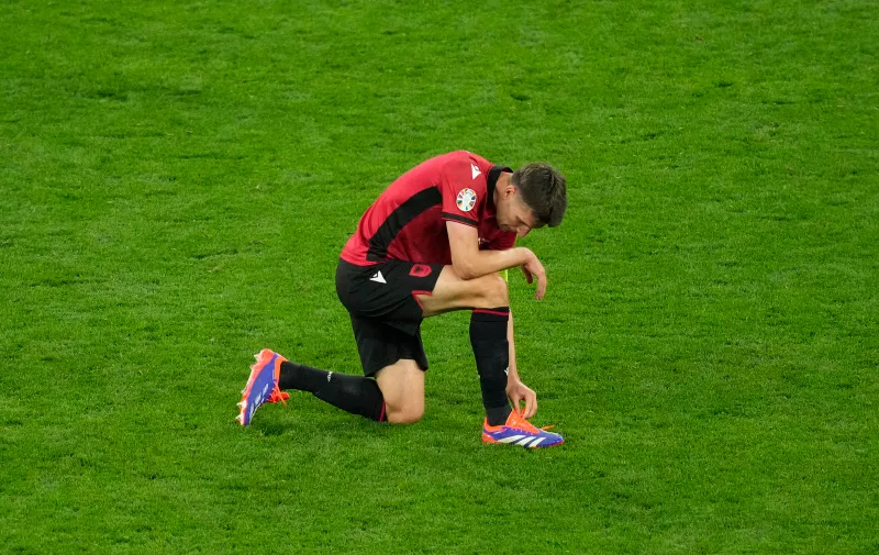 Albania's Berat Djimsiti is dejected at the end of a Group B match between Italy and Albania at the Euro 2024 soccer tournament in Dortmund, Germany, Saturday, June 15, 2024. (AP Photo/Andreea Alexandru)