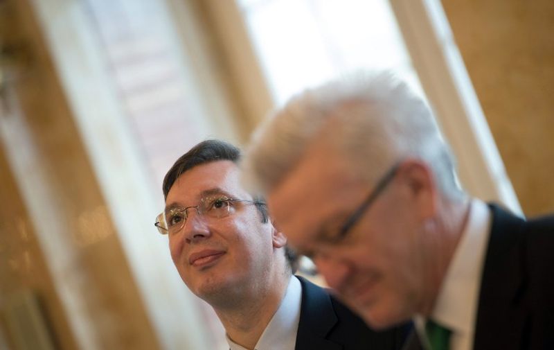 The Prime Minister of the Republic of Serbia, Aleksandar Vucic (L), and the State Premier of Baden-Wuerttemberg, Winfried Kretschmann (Green Party, R), stand in the New Palace in Stuttgart, Germany, 04 February 2015. PHOTO: MARIJAN MURAT/dpa