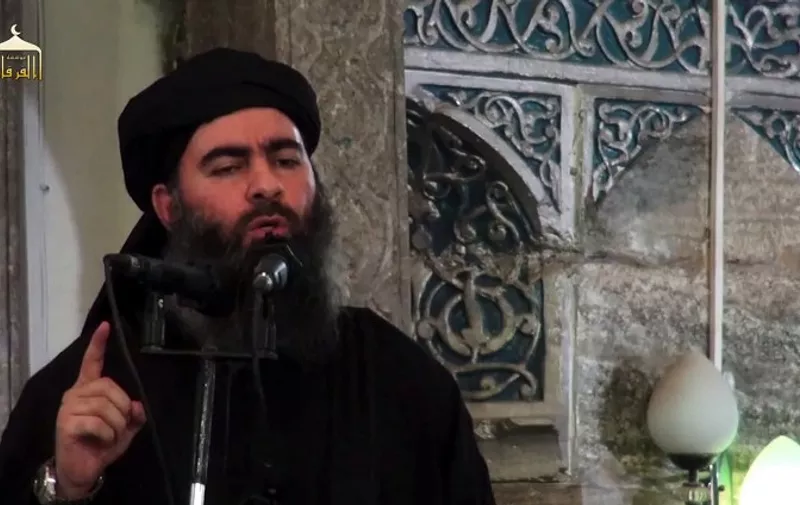 An image grab taken from a propaganda video released on July 5, 2014 by al-Furqan Media allegedly shows the leader of the Islamic State (IS) jihadist group, Abu Bakr al-Baghdadi, aka Caliph Ibrahim, adressing Muslim worshippers at a mosque in the militant-held northern Iraqi city of Mosul. Baghdadi, who on June 29 proclaimed a "caliphate" straddling Syria and Iraq, purportedly ordered all Muslims to obey him in the video released on social media.    AFP PHOTO / HO / AL-FURQAN MEDIA 
== RESTRICTED TO EDITORIAL USE - MANDATORY CREDIT "AFP PHOTO / HO / AL-FURQAN MEDIA " - NO MARKETING NO ADVERTISING CAMPAIGNS - DISTRIBUTED AS A SERVICE TO CLIENTS FROM ALTERNATIVE SOURCES, AFP IS NOT RESPONSIBLE FOR ANY DIGITAL ALTERATIONS TO THE PICTURE'S EDITORIAL CONTENT, DATE AND LOCATION WHICH CANNOT BE INDEPENDENTLY VERIFIED == / AFP PHOTO / AL-FURQAN MEDIA / -