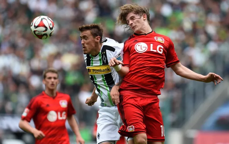Leverkusen's Croatian defender Tin Jedvaj (R) and Moenchengladbach's striker Max Kruse vie for the ball during the German first division Bundesliga football match between Borussia Moenchengladbach and Bayer 04 Leverkusen at the Borussia Park Stadium in Moenchengladbach, western Germany on May 9, 2015.  AFP PHOTO / PATRIK STOLLARZ

RESTRICTIONS - DFL RULES TO LIMIT THE ONLINE USAGE DURING MATCH TIME TO 15 PICTURES PER MATCH. IMAGE SEQUENCES TO SIMULATE VIDEO IS NOT ALLOWED AT ANY TIME. FOR FURTHER QUERIES PLEASE CONTACT DFL DIRECTLY AT + 49 69 650050.