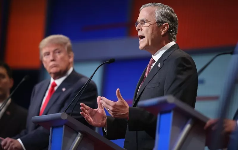 CLEVELAND, OH - AUGUST 06: Republican presidential candidate Donald Trump listens as Jeb Bush (R) fields a question during the first Republican presidential debate hosted by Fox News and Facebook at the Quicken Loans Arena on August 6, 2015 in Cleveland, Ohio. The top ten GOP candidates were selected to participate in the debate based on their rank in an average of the five most recent political polls.   Scott Olson/Getty Images/AFP