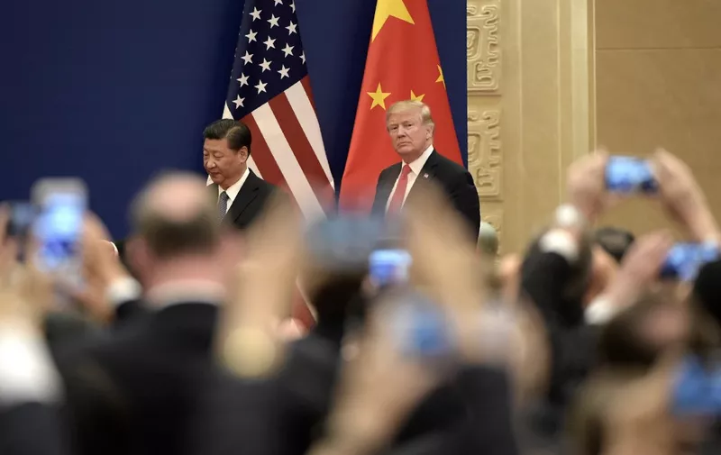 US President Donald Trump and Chinese President Xi Jinping attend a business meeting at the Great Hall of the People in Beijing on November 9, 2017. - Donald Trump and Xi Jinping put their professed friendship to the test on November 9 as the least popular US president in decades and the newly empowered Chinese leader met for tough talks on trade and North Korea. (Photo by FRED DUFOUR / AFP)