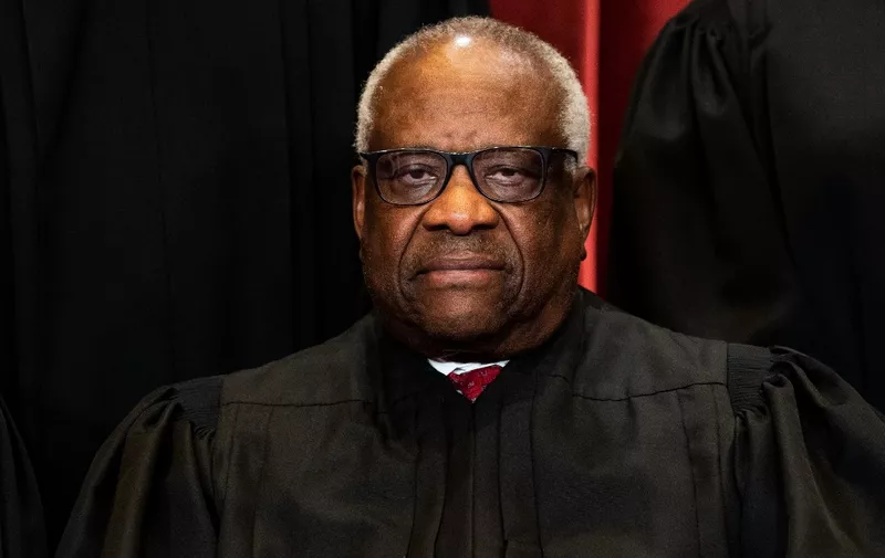 Associate Justice Clarence Thomas sits during a group photo of the Justices at the Supreme Court in Washington, DC on April 23, 2021. (Photo by Erin Schaff / POOL / AFP)
